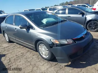 2010 Honda Civic Hybrid with VIN JHMFA3F2XAS006491, listed as a IAAI auction lot 41709789 with 218,337 mi miles. Bid and sale history available at carsss.com. Image 1.