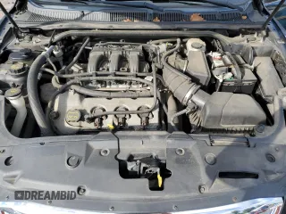 2012 Ford Taurus Limited z VIN 1FAHP2FW6CG136463, wystawiony jako Copart lot #57159005 z przebiegiem 124 833 mil mil oraz Szkoda całkowita • Salvage title. Historia ofert i sprzedaży dostępna na DreamBid. Obrazek 11.