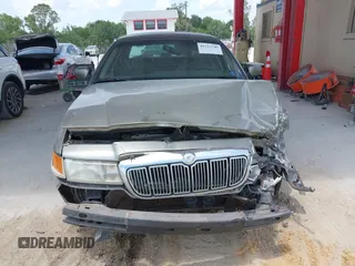 2001 Mercury Grand Marquis GS z VIN 2MEFM74W41X702619, wystawiony jako IAAI lot #42323749 z przebiegiem 124 748 mil mil oraz . Historia ofert i sprzedaży dostępna na DreamBid. Obrazek 13.
