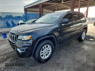 2020 Jeep Grand Cherokee Laredo E with VIN 1C4RJEAG7LC113542, listed as a Copart auction lot 62715585 with 64,124 mi miles and Salvage title. Bid and sale history available at DreamBid. Image 1.