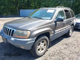 2000 Jeep Grand Cherokee Laredo with VIN 1J4GW48S8YC380039, listed as a IAAI auction lot 42510307 with 215,776 mi miles and . Bid and sale history available at DreamBid. Image 2.