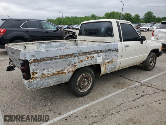 1988 Toyota Pickup z VIN JT4RN50R0J5122639, wystawiony jako Copart lot #52792445 z przebiegiem 233 407 mil mil oraz Szkody całkowita. Historia ofert i sprzedaży dostępna na DreamBid. Obrazek 3.