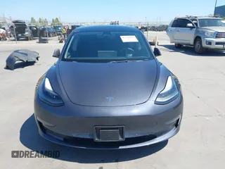 2023 Tesla Model 3 with VIN 5YJ3E1EAXPF405588, listed as a IAAI auction lot 42348952 with 30,788 mi miles and . Bid and sale history available at DreamBid. Image 13.