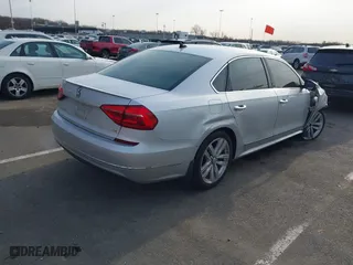 2016 Volkswagen Passat 1.8T SEL with VIN 1VWCT7A3XGC018484, listed as a IAAI auction lot 41763388 with 123,484 mi miles. Bid and sale history available at carsss.com. Image 4.
