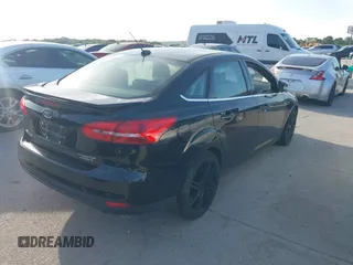 2016 Ford Focus Titanium with VIN 1FADP3J26GL335843, listed as a IAAI auction lot 42799795 with 167,506 mi miles and . Bid and sale history available at DreamBid. Image 4.