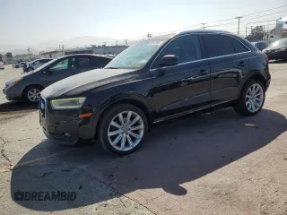 2015 Audi Q3 Premium Plus with VIN WA1EFCFS8FR002771, listed as a Copart auction lot 62912355 with 115,579 mi miles and Salvage title. Bid and sale history available at DreamBid. Image 1.