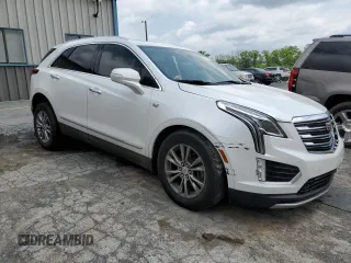 2020 Cadillac XT5 Premium Luxury FWD with VIN 1GYKNCRS5LZ229686, listed as a Copart auction lot 57391915 with 54,491 mi miles and Salvage title. Bid and sale history available at DreamBid. Image 4.