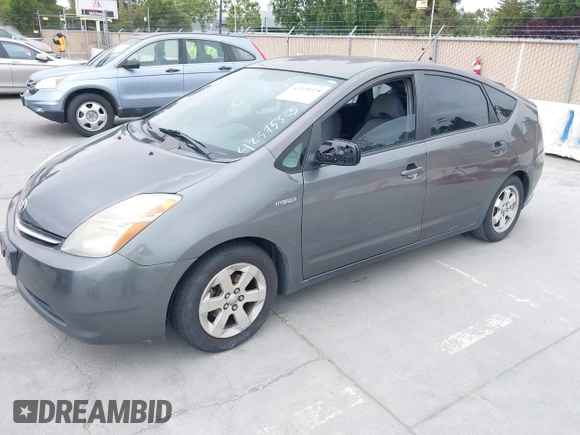 2007 Toyota Prius z VIN JTDKB20U573236900, wystawiony jako IAAI lot #42375325 z przebiegiem Nie podano mil oraz . Historia ofert i sprzedaży dostępna na DreamBid. Obrazek 2.