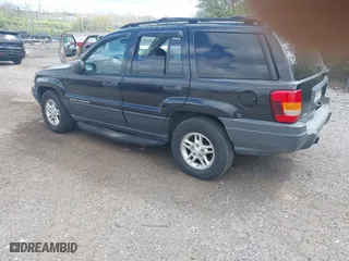 2003 Jeep Grand Cherokee Laredo with VIN 1J8GW48S63C596866, listed as a IAAI auction lot 42060430 with 129,849 mi miles. Bid and sale history available at carsss.com. Image 3.