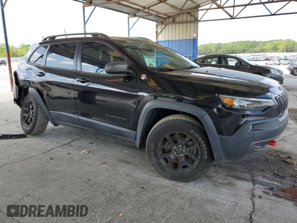 2019 Jeep Cherokee Trailhawk with VIN 1C4PJMBN7KD374676, listed as a Copart auction lot 51504125 with 34,323 mi miles and Salvage Title. Bid and sale history available at DreamBid. Image 4.