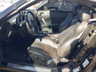 2004 Nissan 350Z Touring with VIN JN1AZ34D94M102990, listed as a IAAI auction lot 41830661 with 107,520 mi miles. Bid and sale history available at carsss.com. Image 8.