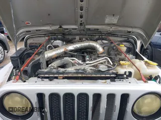 2005 Jeep Wrangler X z VIN 1J4FA39S95P370868, wystawiony jako IAAI lot #42476186 z przebiegiem 144 986 mil mil oraz . Historia ofert i sprzedaży dostępna na DreamBid. Obrazek 10.