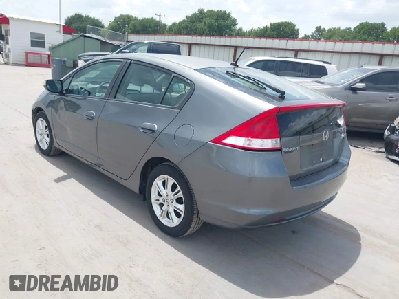 2010 Honda Insight EX with VIN JHMZE2H74AS040110, listed as a IAAI auction lot 42643669 with 189,531 mi miles and . Bid and sale history available at DreamBid. Image 3.