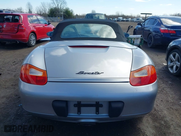 1999 Porsche Boxster z VIN WP0CA2989XU627152, wystawiony jako IAAI lot #41805432 z przebiegiem 112 380 mil mil oraz . Historia ofert i sprzedaży dostępna na DreamBid. Obrazek 16.
