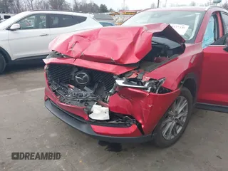 2020 Mazda CX-5 Grand Touring with VIN JM3KFADMXL0842026, listed as a IAAI auction lot 41477339 with 60,755 mi miles. Bid and sale history available at carsss.com. Image 6.