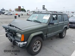 1996 Jeep Cherokee Sport z VIN 1J4FT68S6TL267408, wystawiony jako IAAI lot #42385629 z przebiegiem 268 753 mil mil oraz . Historia ofert i sprzedaży dostępna na DreamBid. Obrazek 2.