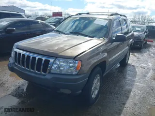 2001 Jeep Grand Cherokee Laredo with VIN 1J4GW48S21C572272, listed as a IAAI auction lot 41695754 with 169,229 mi miles. Bid and sale history available at carsss.com. Image 17.