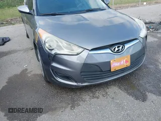 2013 Hyundai Veloster w/Black Int with VIN KMHTC6AD6DU169765, listed as a IAAI auction lot 41928516 with 130,708 mi miles and . Bid and sale history available at DreamBid. Image 6.