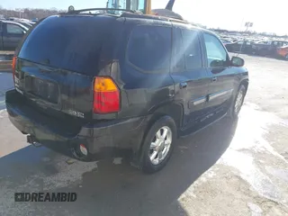2005 GMC Envoy SLE z VIN 1GKDT13S952288760, wystawiony jako IAAI lot #41671656 z przebiegiem Nie podano mil oraz . Historia ofert i sprzedaży dostępna na DreamBid. Obrazek 4.