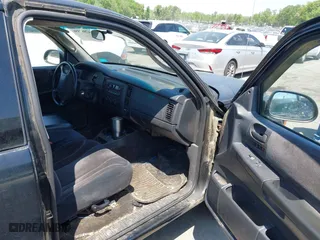 2004 Dodge Dakota SLT with VIN 1D7GL42N14S527342, listed as a IAAI auction lot 42081956 with 165,157 mi miles. Bid and sale history available at carsss.com. Image 5.