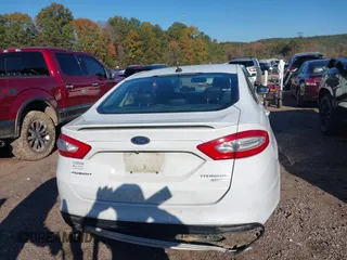 2016 Ford Fusion Titanium with VIN 3FA6P0K98GR150939, listed as a IAAI auction lot 40994523 with 144,051 mi miles. Bid and sale history available at carsss.com. Image 16.