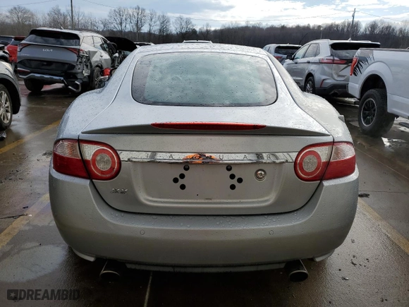 2007 Jaguar XK with VIN SAJWA43B775B07074, listed as a Copart auction lot 86350144 with 117,915 mi miles and Salvage Title. Bid and sale history available at carsss.com. Image 6.