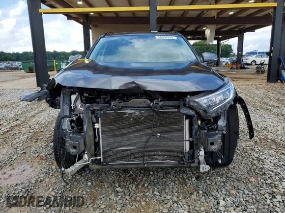2021 Toyota RAV4 XLE Premium with VIN 2T3C1RFV9MC109917, listed as a Copart auction lot 58594335 with 64,995 mi miles and Salvage title. Bid and sale history available at DreamBid. Image 5.