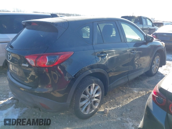2013 Mazda CX-5 Grand Touring with VIN JM3KE2DE1D0164723, listed as a IAAI auction lot 41364590 with 227,932 mi miles. Bid and sale history available at carsss.com. Image 4.