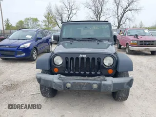 2007 Jeep Wrangler Unlimited X with VIN 1J4GA39177L153387, listed as a IAAI auction lot 42021211 with 207,965 mi miles and . Bid and sale history available at DreamBid. Image 12.