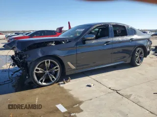2020 BMW 5 Series M550i xDrive z VIN WBAJS7C07LCD97275, wystawiony jako Copart lot #85764434 z przebiegiem Nie podano mil oraz Czysty tytuł • Clean title. Historia ofert i sprzedaży dostępna na DreamBid. Obrazek 1.