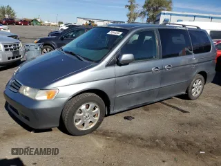 2002 Honda Odyssey EX z VIN 2HKRL18722H527856, wystawiony jako Copart lot #76944494 z przebiegiem 87 791 mil mil oraz Szkoda całkowita • Salvage title. Historia ofert i sprzedaży dostępna na DreamBid. Obrazek 1.