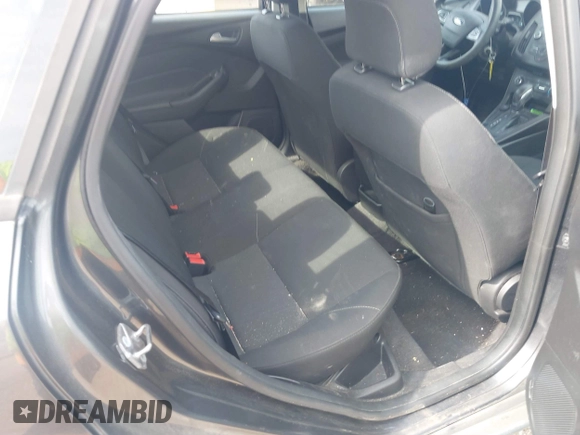 2018 Ford Focus SE with VIN 1FADP3F29JL288761, listed as a IAAI auction lot 42290510 with 93,463 mi miles and . Bid and sale history available at DreamBid. Image 8.