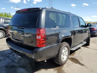 2013 Chevrolet Suburban LT with VIN 1GNSKJE70DR138631, listed as a Copart auction lot 57778185 with 176,934 mi miles and Salvage title. Bid and sale history available at DreamBid. Image 3.