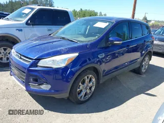 2013 Ford Escape SEL with VIN 1FMCU9HX3DUB97778, listed as a IAAI auction lot 42195445 with 147,154 mi miles. Bid and sale history available at carsss.com. Image 2.