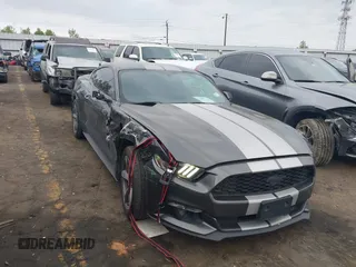 2016 Ford Mustang V6 z VIN 1FA6P8AM7G5303236, wystawiony jako IAAI lot #42037986 z przebiegiem 99 557 mil mil oraz . Historia ofert i sprzedaży dostępna na DreamBid. Obrazek 1.