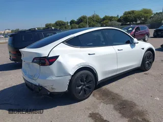 2024 Tesla Model Y with VIN 7SAYGDED9RF161420, listed as a IAAI auction lot 41892788 with 12,353 mi miles and . Bid and sale history available at DreamBid. Image 4.