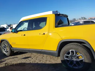 2022 Rivian R1T Adventure Package with VIN 7FCTGAAA2NN005811, listed as a IAAI auction lot 41706558 with 21,336 mi miles. Bid and sale history available at carsss.com. Image 14.