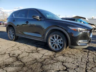 2020 Mazda CX-5 Grand Touring with VIN JM3KFADM0L0786565, listed as a Copart auction lot 48430915 with 60,390 mi miles and Salvage Title. Bid and sale history available at carsss.com. Image 4.