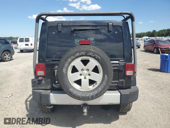2012 Jeep Wrangler Unlimited Sahara with VIN 1C4HJWEG5CL205826, listed as a Copart auction lot 58222115 with 98,940 mi miles and Salvage title. Bid and sale history available at DreamBid. Image 6.
