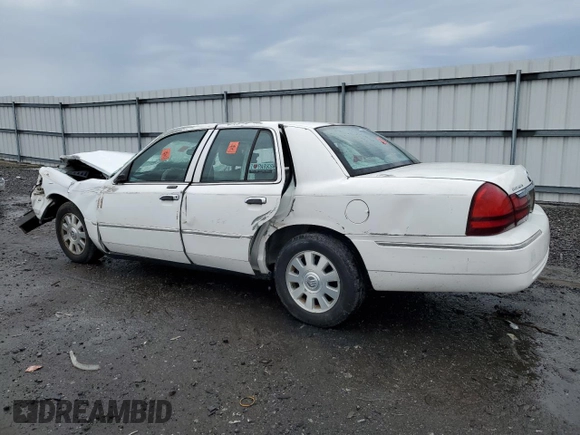 2003 Mercury Grand Marquis LS Premium with VIN 2MEFM75W13X667779, listed as a Copart auction lot 52869985 with 127,506 mi miles and Salvage Title. Bid and sale history available at DreamBid. Image 2.
