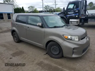 2012 Scion xB z VIN JTLZE4FE1CJ014494, wystawiony jako Copart lot #57779675 z przebiegiem 151 857 mil mil oraz Szkody całkowita. Historia ofert i sprzedaży dostępna na DreamBid. Obrazek 4.