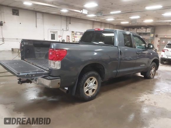 2010 Toyota Tundra 4WD Truck with VIN 5TFUM5F16AX006879, listed as a IAAI auction lot 40447273 with 219,498 mi miles. Bid and sale history available at carsss.com. Image 4.