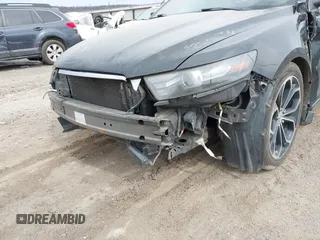 2013 Ford Taurus SHO z VIN 1FAHP2KT6DG174191, wystawiony jako IAAI lot #41752293 z przebiegiem 147 607 mil mil oraz . Historia ofert i sprzedaży dostępna na DreamBid. Obrazek 12.