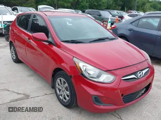 2014 Hyundai Accent GS with VIN KMHCT5AE1EU172027, listed as a IAAI auction lot 42165016 with 140,943 mi miles. Bid and sale history available at carsss.com. Image 1.