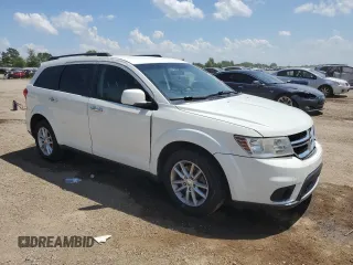2015 Dodge Journey SXT with VIN 3C4PDCBG5FT628212, listed as a Copart auction lot 60663695 with 145,024 mi miles and Salvage title. Bid and sale history available at DreamBid. Image 4.