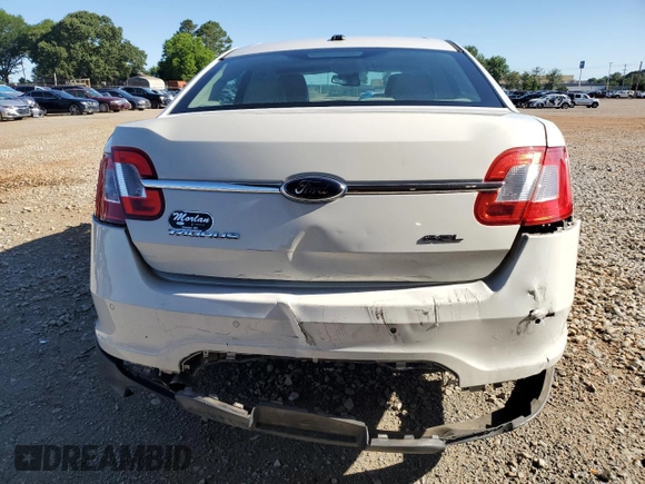 2011 Ford Taurus SEL z VIN 1FAHP2EW2BG188513, wystawiony jako Copart lot #58017755 z przebiegiem 211 530 mil mil oraz Szkoda całkowita • Salvage title. Historia ofert i sprzedaży dostępna na DreamBid. Obrazek 6.