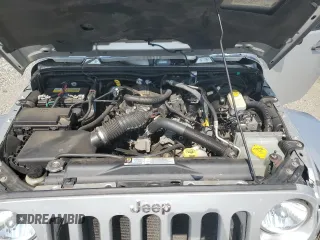 2009 Jeep Wrangler Sahara with VIN 1J4FA54119L747068, listed as a Copart auction lot 71209904 with 86,978 mi miles and Salvage title. Bid and sale history available at DreamBid. Image 12.