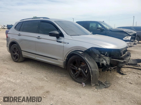 2023 Volkswagen Tiguan SE R-Line Black with VIN 3VVCB7AX5PM128335, listed as a Copart auction lot 56128305 with 21,524 mi miles and Salvage title. Bid and sale history available at DreamBid. Image 4.