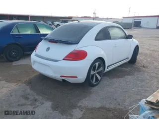 2012 Volkswagen Beetle 2.0T Turbo PZEV with VIN 3VW4A7AT6CM648540, listed as a IAAI auction lot 41326503 with 118,929 mi miles. Bid and sale history available at carsss.com. Image 4.