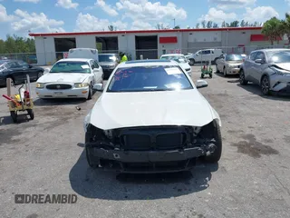 2014 BMW 5 Series 535i xDrive with VIN WBA5B3C56ED536747, listed as a IAAI auction lot 41900220 with 132,757 mi miles and . Bid and sale history available at carsss.com. Image 13.